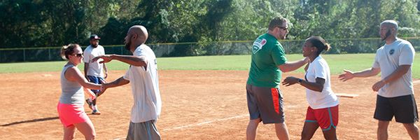 kickball participants greeting each other